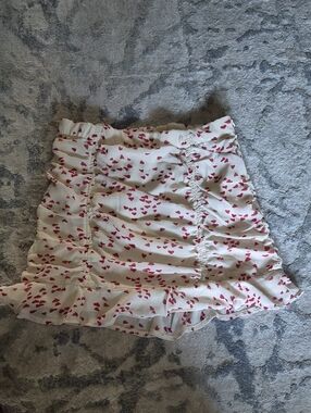 White Mini Skirt with Pink Heart Print and Ruffle Hem